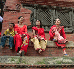 Three Nepali women in red