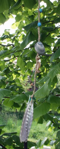 String of feathers and shells