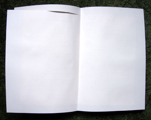 Opened book with Paper